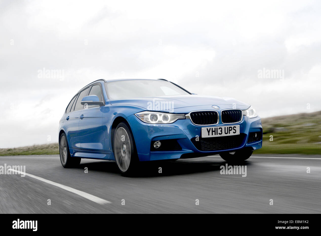 2013 BMW 330d X Drive 4x4 fast break roulant Banque D'Images