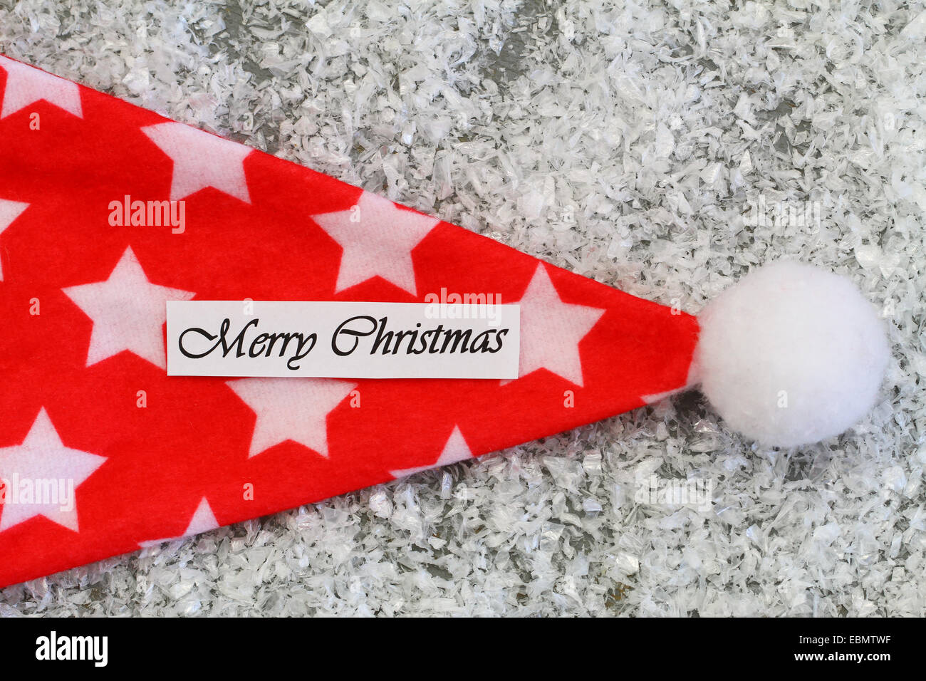 Joyeux Noël carte avec red Christmas hat Banque D'Images