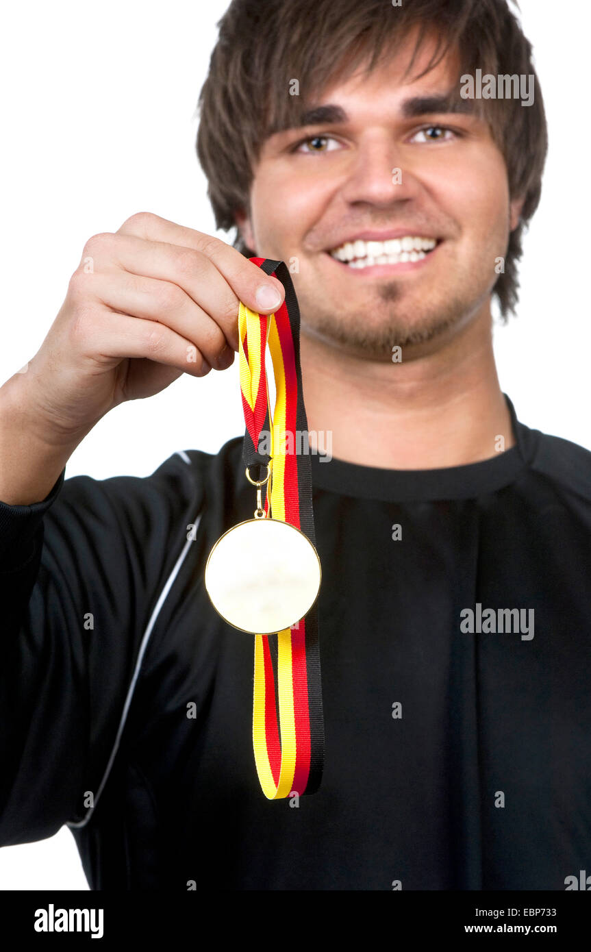 Gagnant montrant sa médaille d'heureusement, Allemagne Banque D'Images