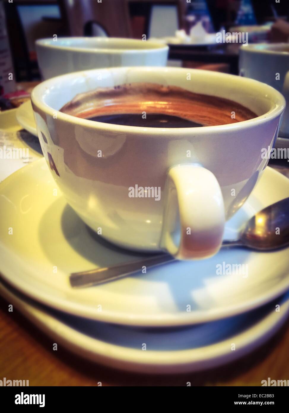 Tasse de café relaxant à la fin d'une dure journée Banque D'Images