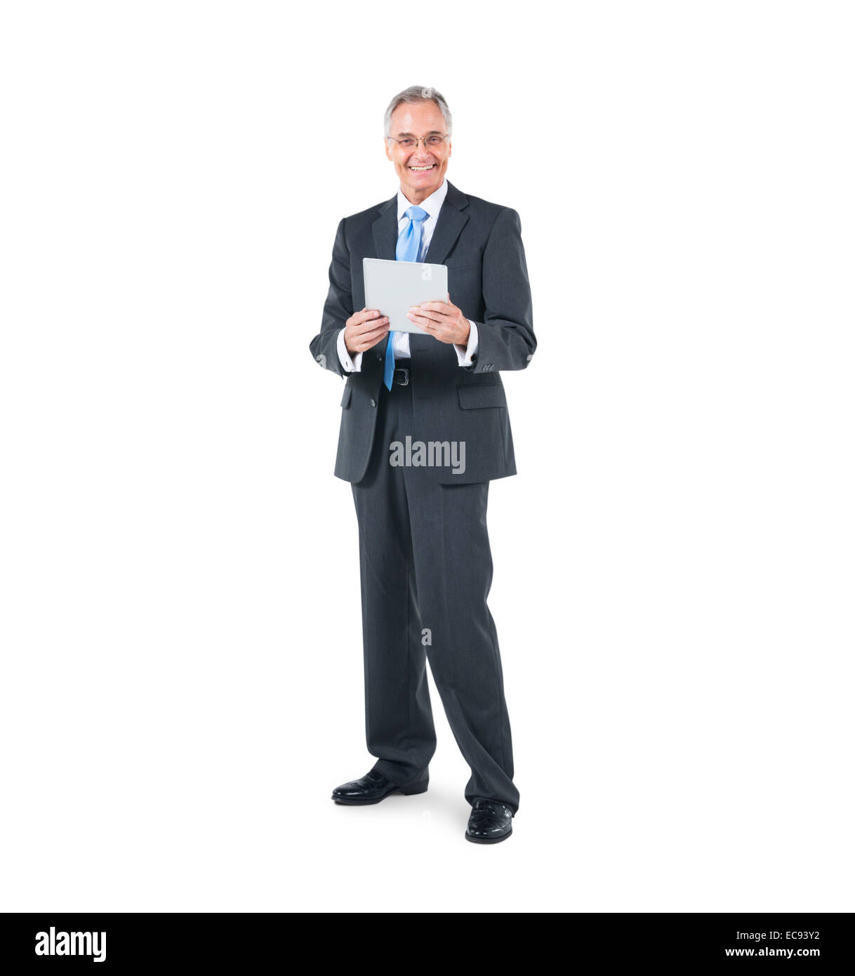 A Cheerful Businessman holding a Digital Tablet Banque D'Images