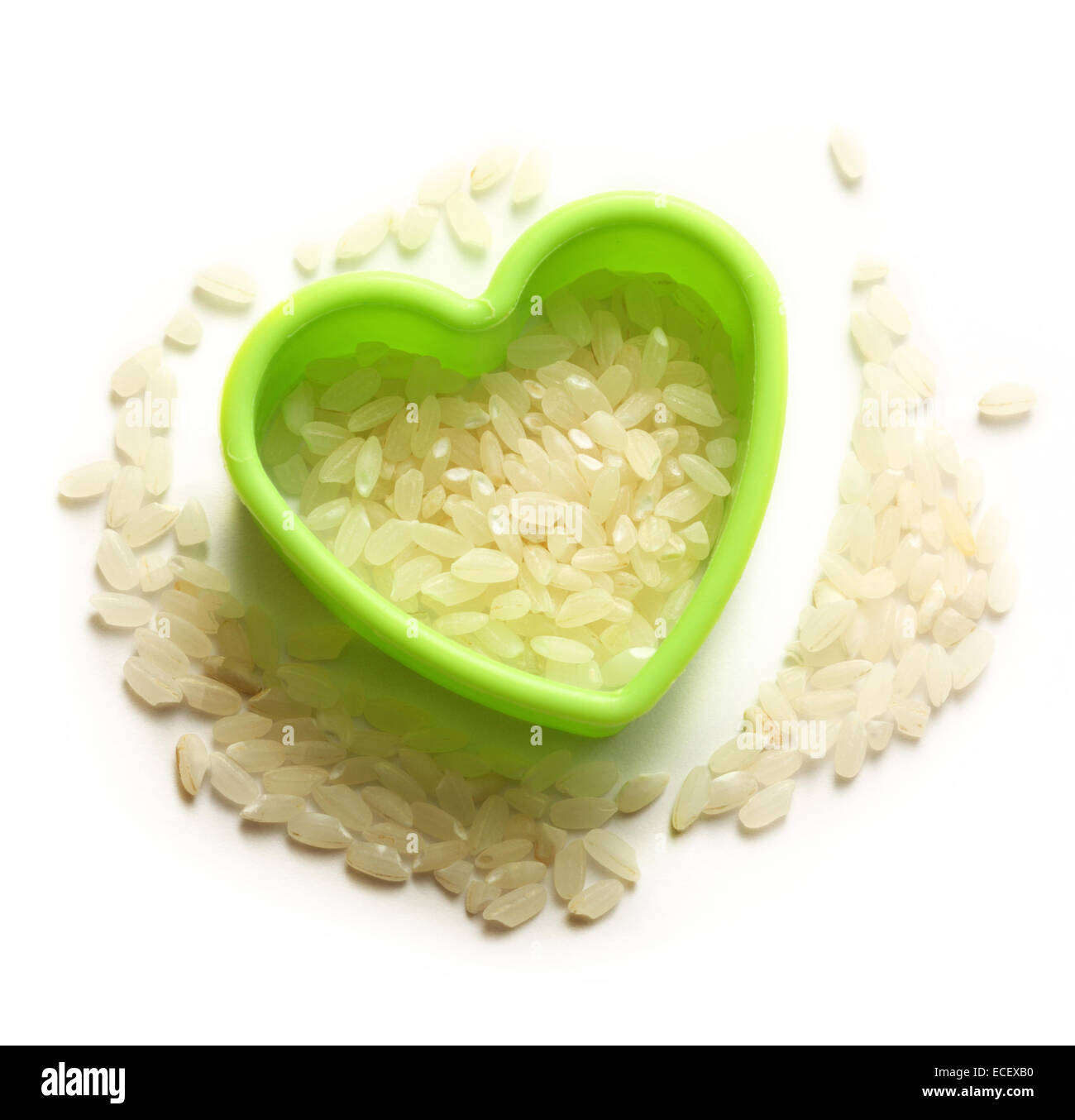 Tas de riz et forme coeur blanc sur Banque D'Images