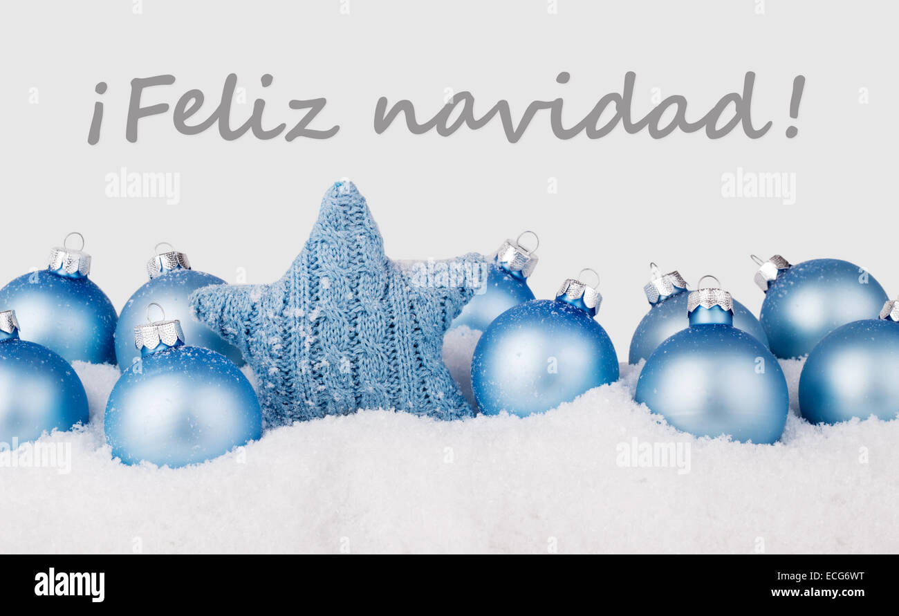 Carte de Noël espagnol avec des boules de noël bleu et texte joyeux
