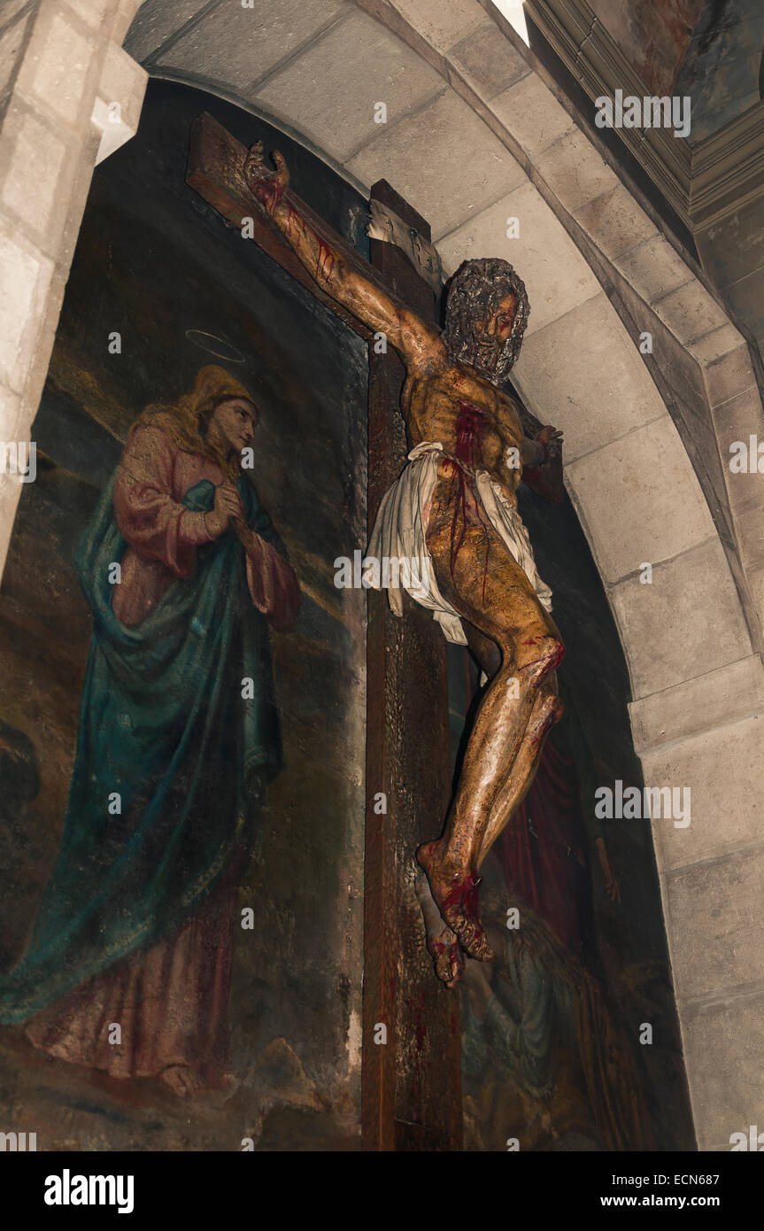 Crucifix sur une fresque de la Vierge et de Madeleine dans le monastère trappiste de Dueñas, Palencia, Espagne Banque D'Images