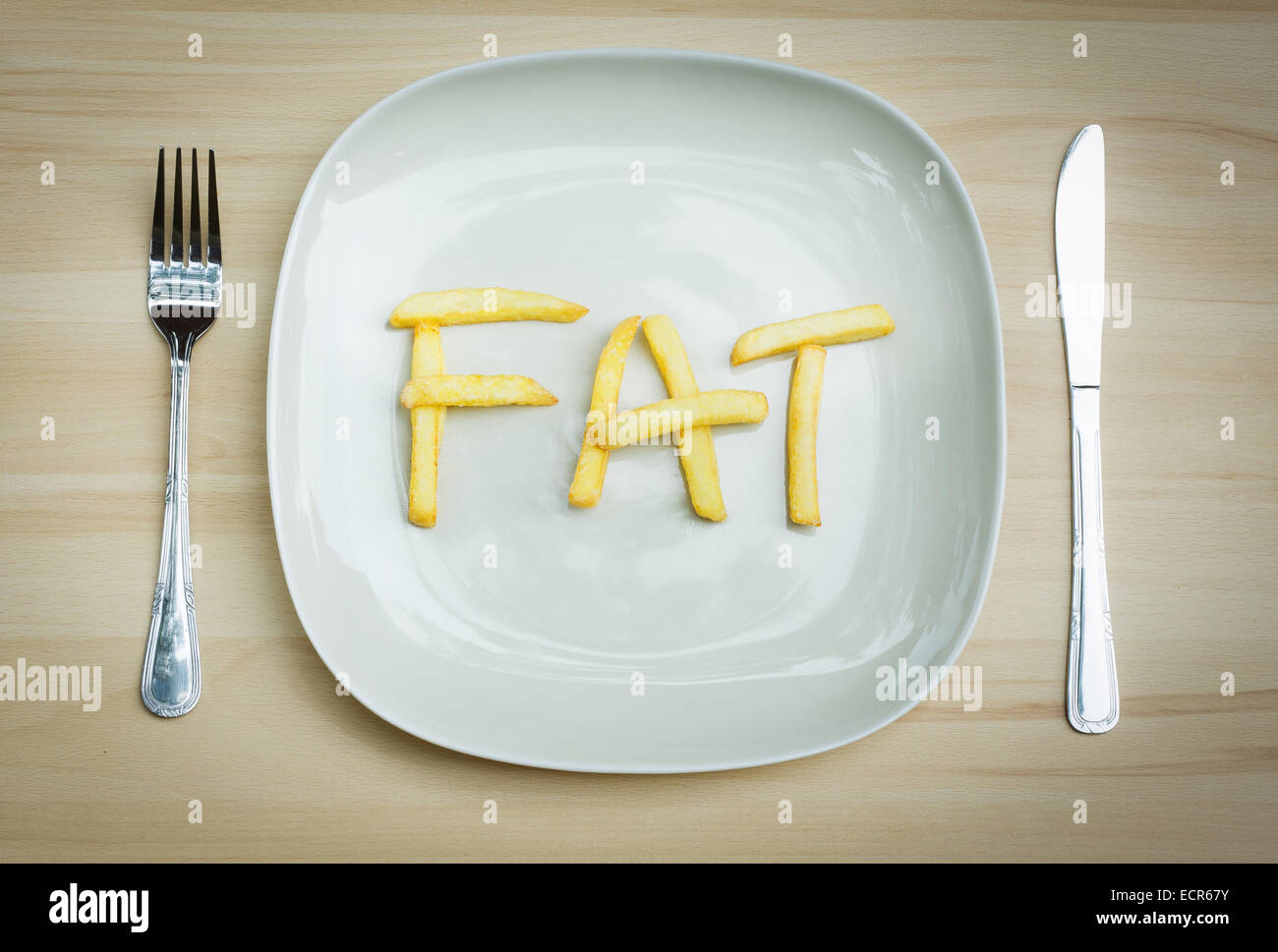 Concept d'aliments malsains - les frites sur une plaque Banque D'Images