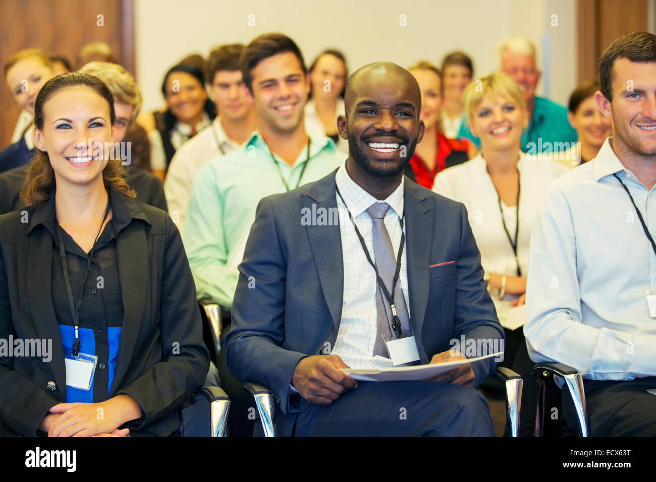 Smiling businessman sitting in conference room, looking at camera Banque D'Images