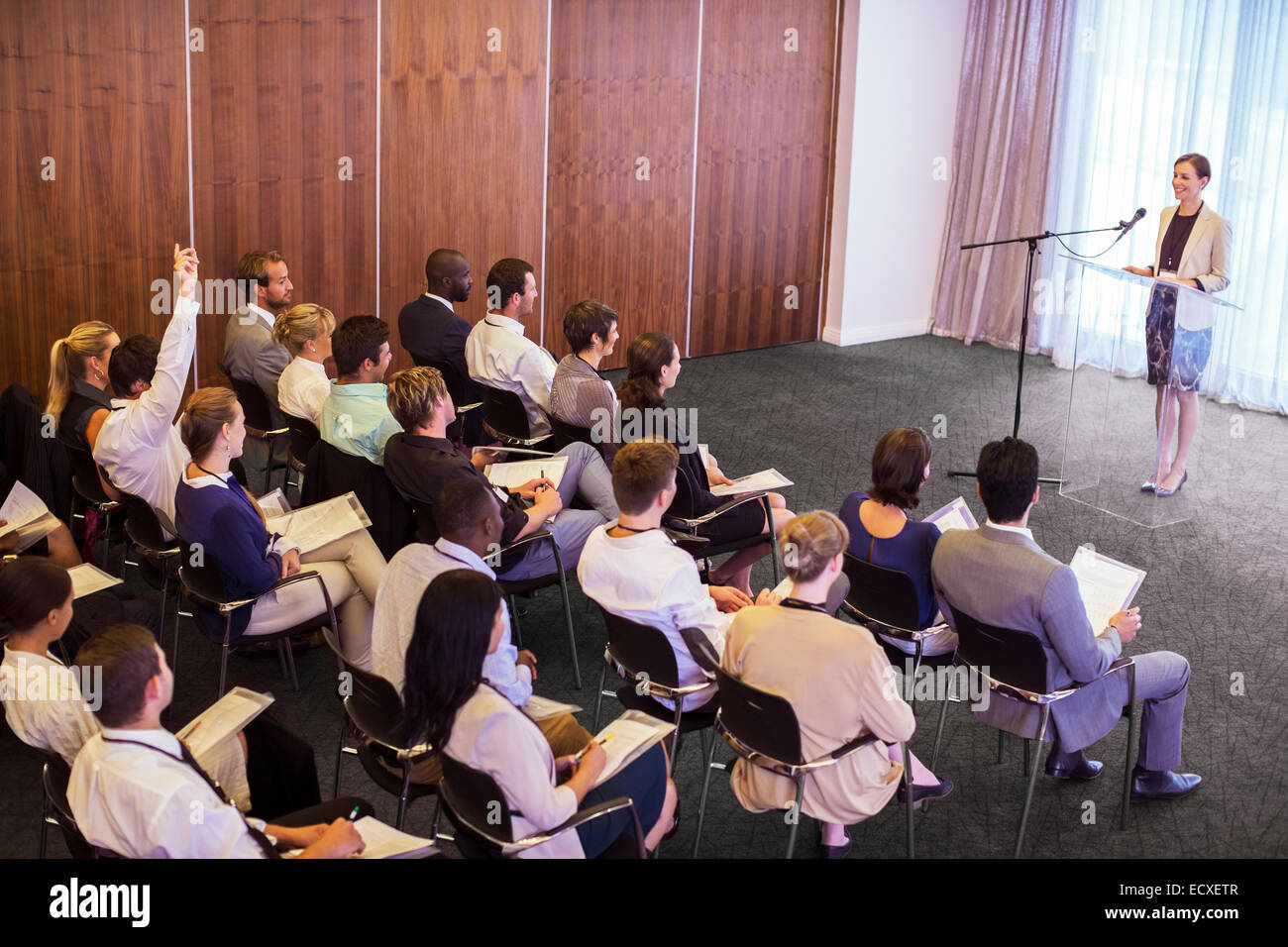 Mid adult businesswoman giving presentation in conference room Banque D'Images