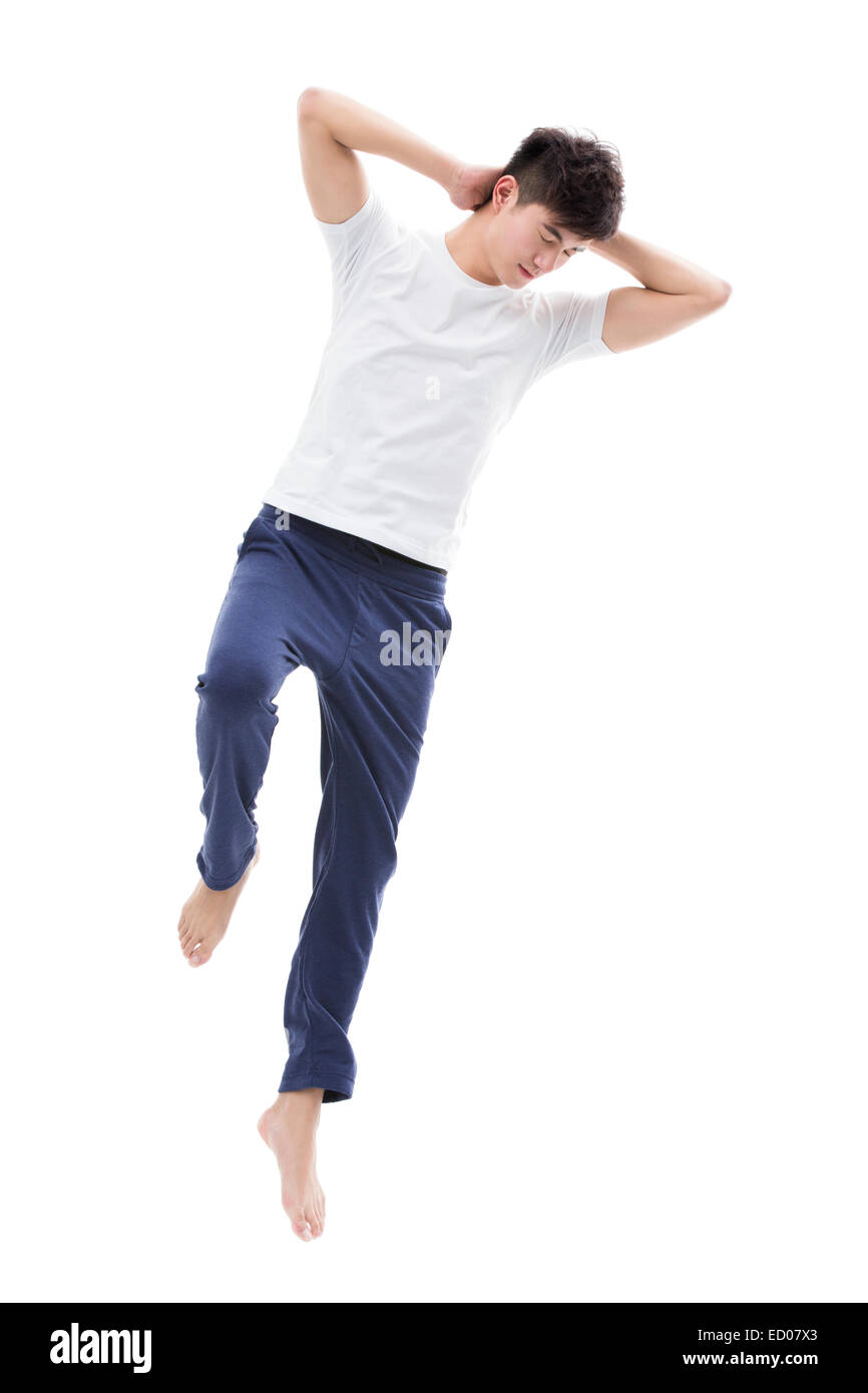 Jeune homme dormant dans les airs Banque D'Images