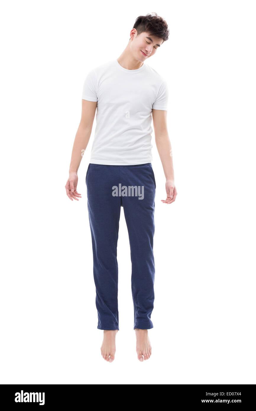 Jeune homme dormant dans les airs Banque D'Images