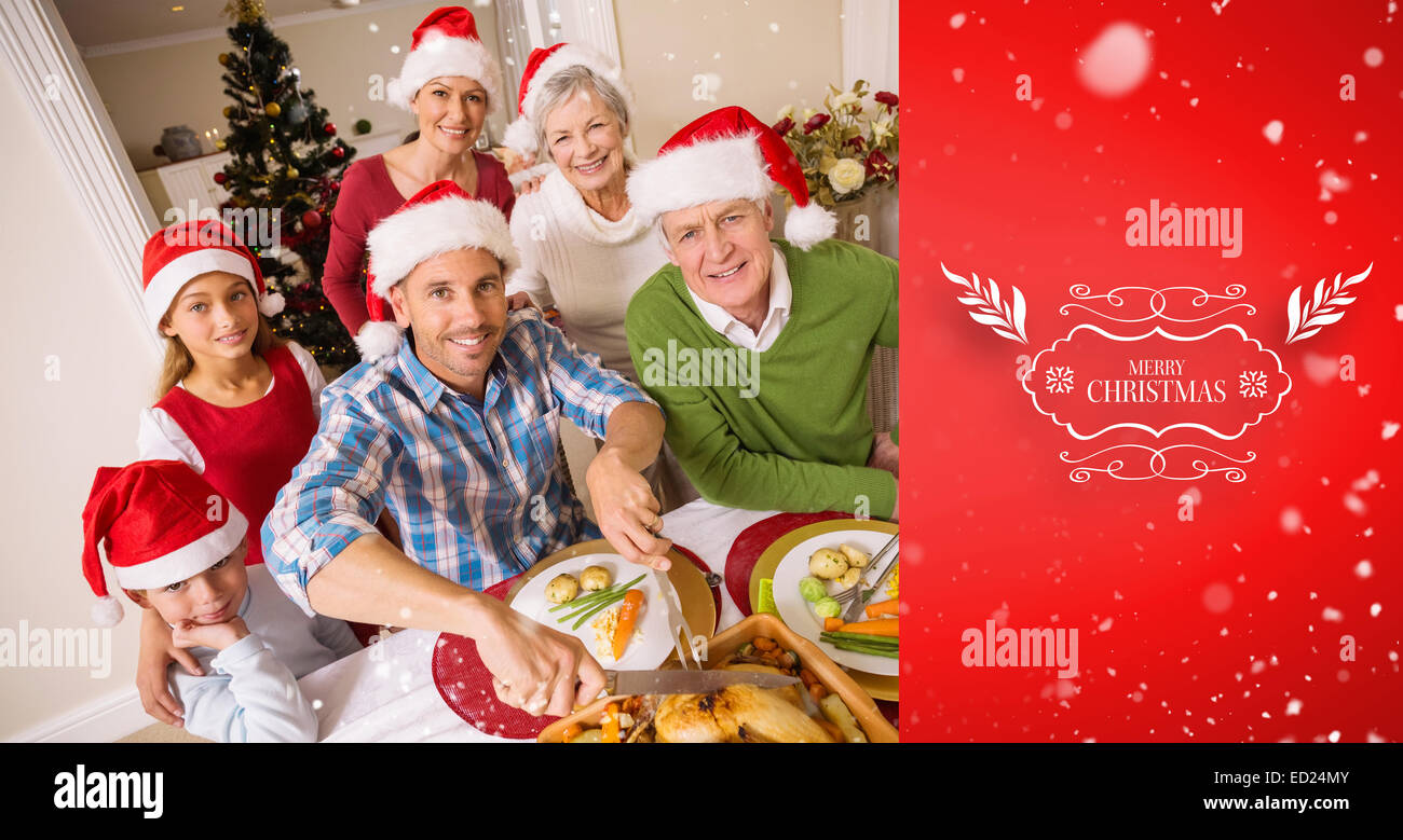 Image composite de père à santa hat poulet sculpture at Christmas dinner Banque D'Images