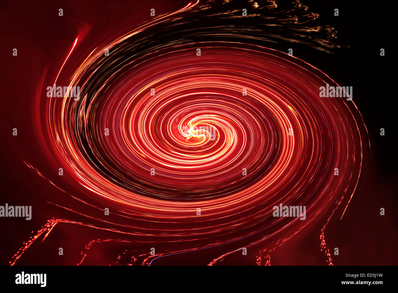 D'artifice toupie en rouge et orange Banque D'Images