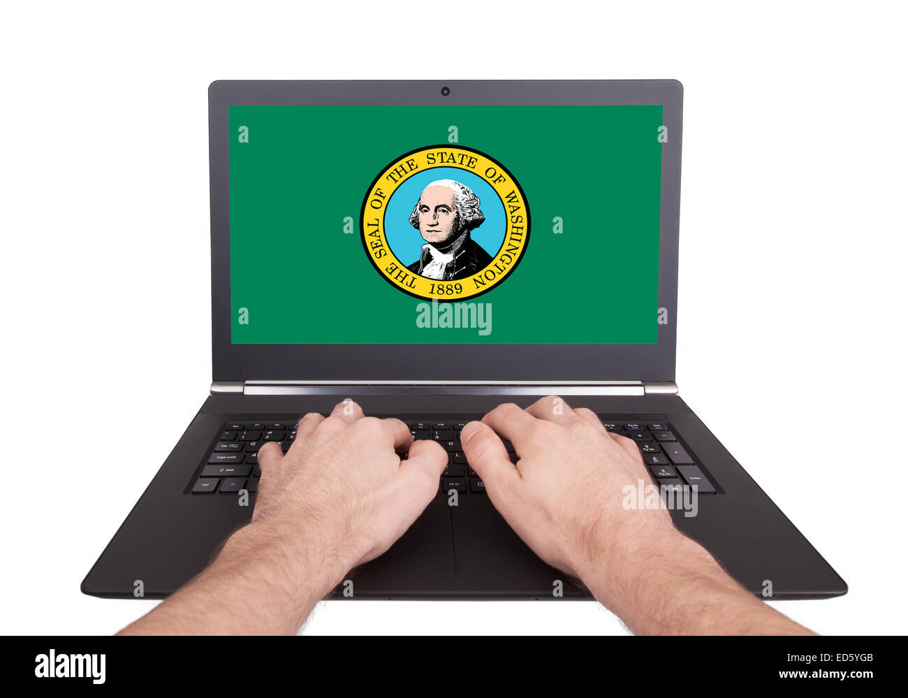 Mains working on laptop montrant à l'écran le drapeau de Washington Banque D'Images