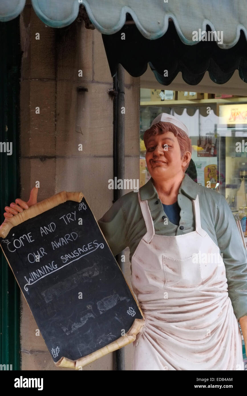 L'effigie d'une publicité de boucherie de saucisses primées. Llangollen, Denbighshire, Wales. Banque D'Images