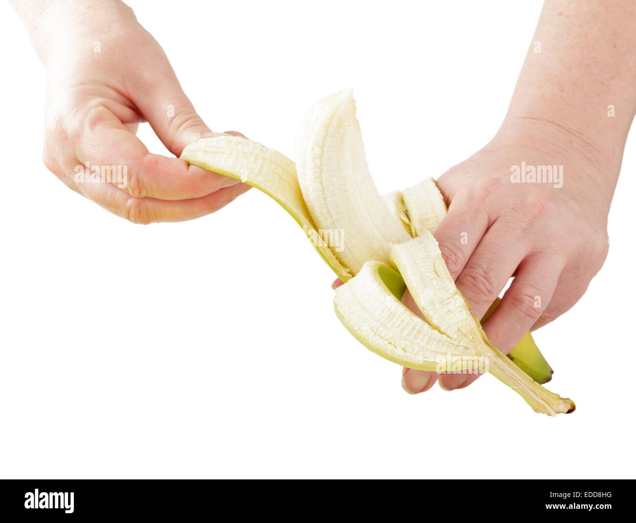 Peler les mains une banane Banque D'Images