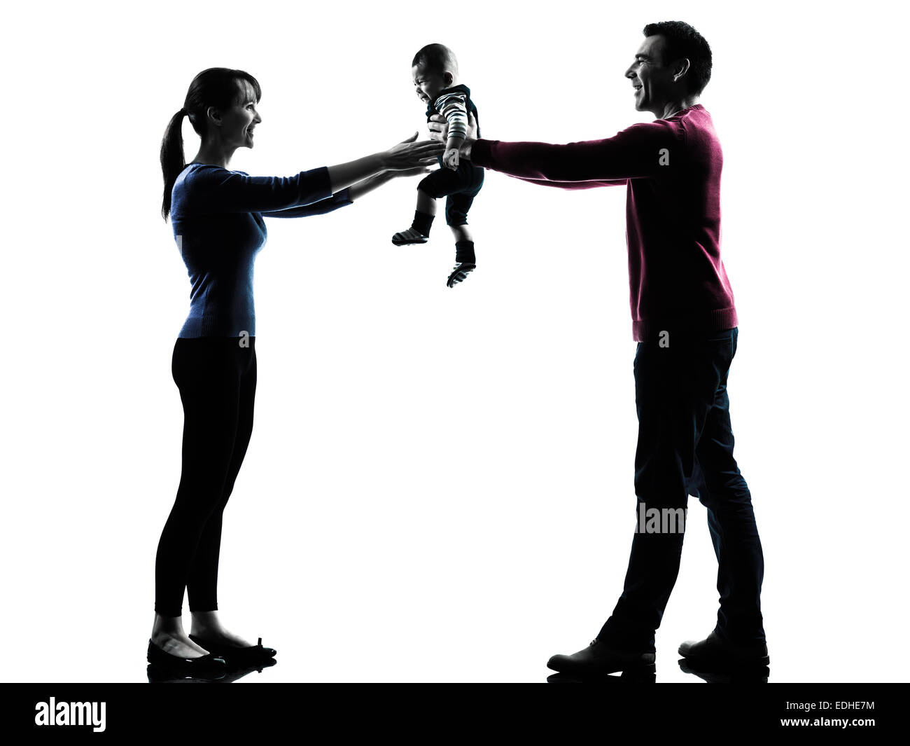 Les parents avec bébé en silhouettes sur fond blanc Banque D'Images