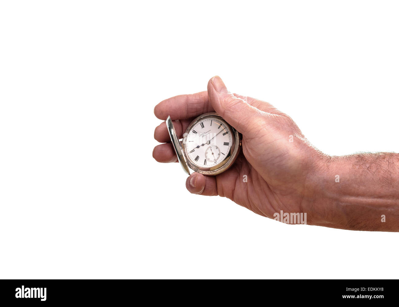 A senior man holding a silver pocket watch. Banque D'Images