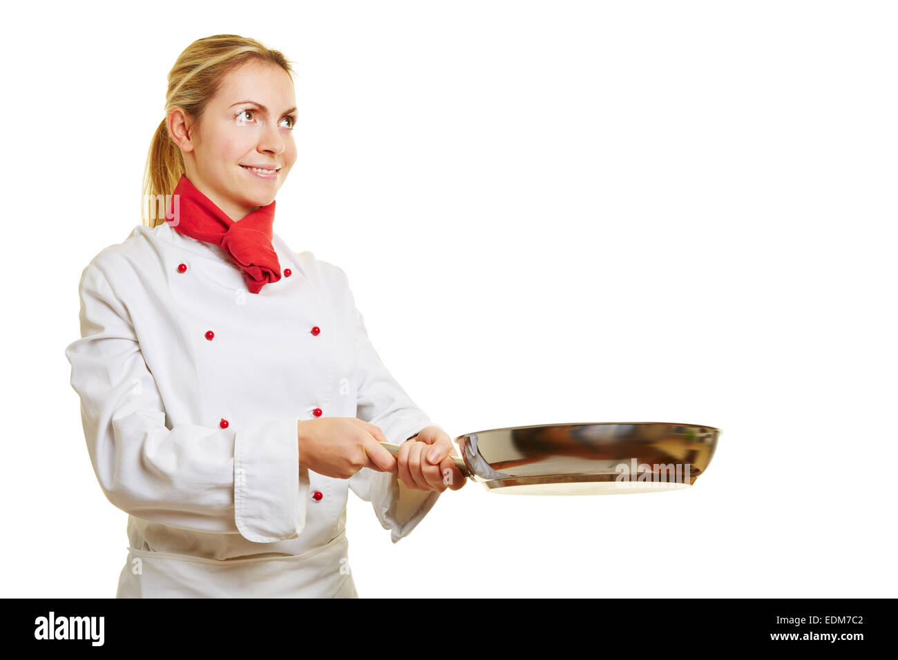 Femme souriante comme chef de cuisine cuisinier avec une poêle Banque D'Images