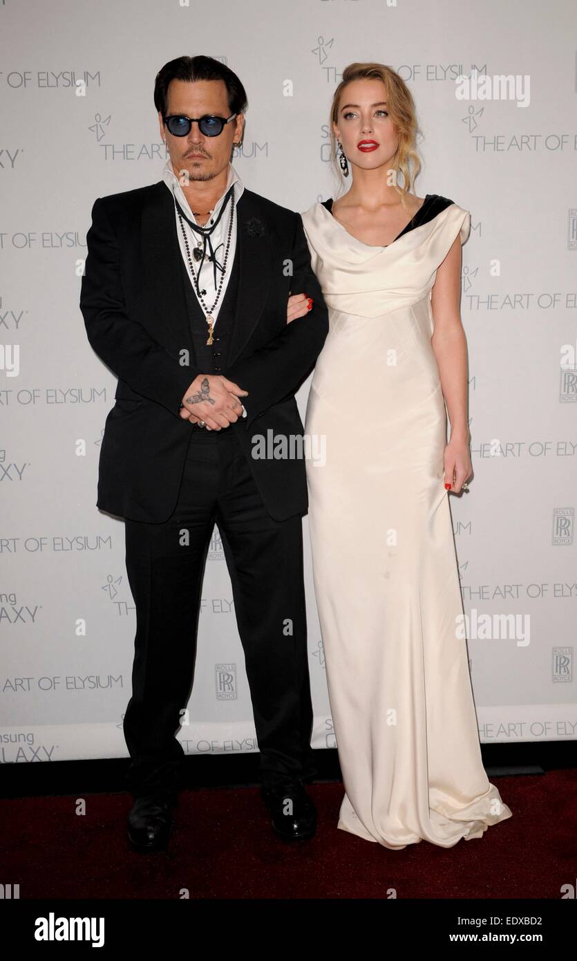 Johnny Depp, ambre entendu devant le hall des arrivées de l'Art de l'Elysium Heaven Gala, Hangar 8, Santa Monica, CA, le 10 janvier 2015. Photo par : Elizabeth Goodenough/Everett Collection Banque D'Images