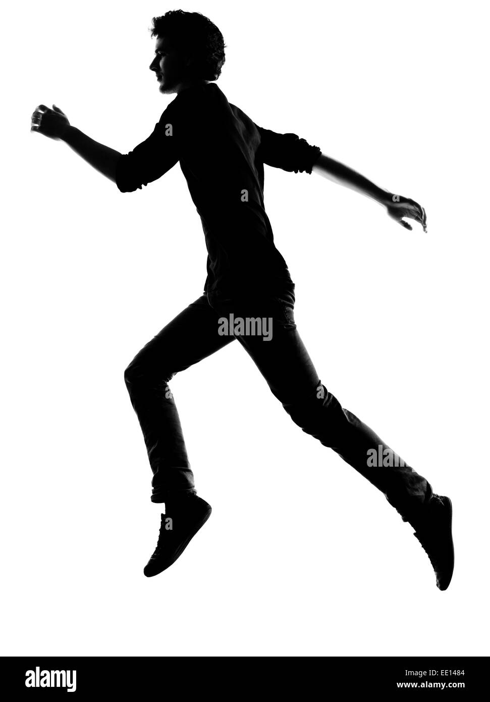 Jeune homme running silhouette en studio isolé sur fond blanc Banque D'Images