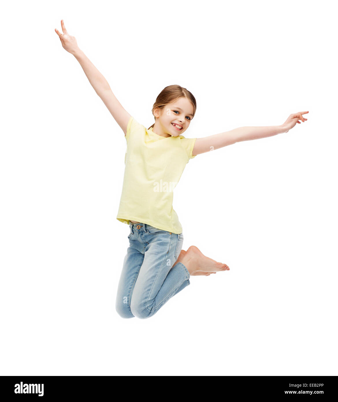 Smiling little girl jumping Banque D'Images