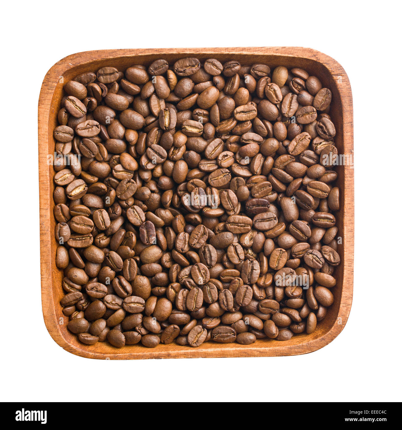 Les grains de café dans le bol en bois Banque D'Images