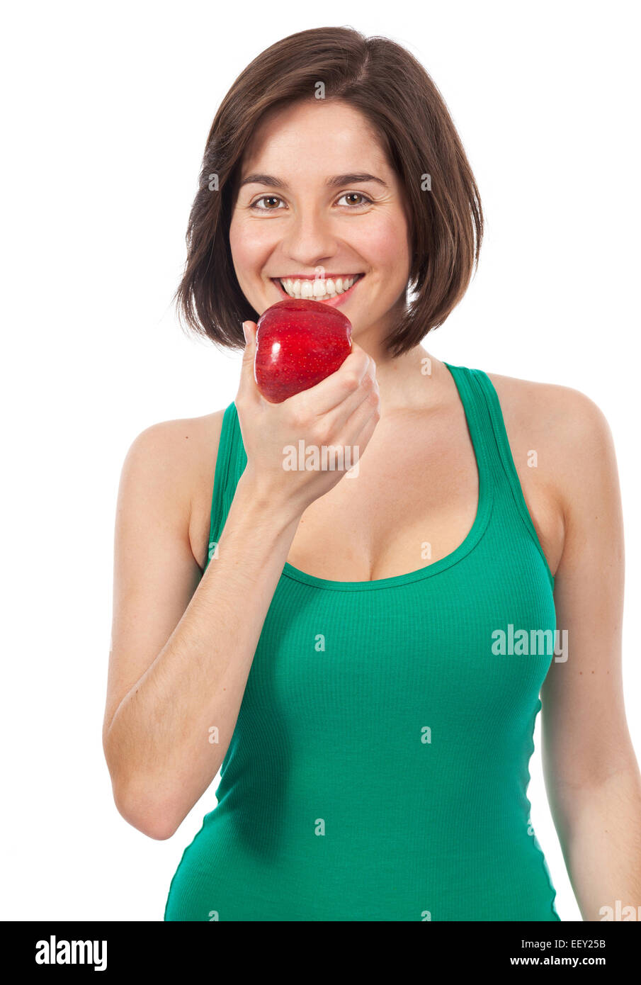 Belle jeune brunette de manger une pomme rouge, isolated on white Banque D'Images