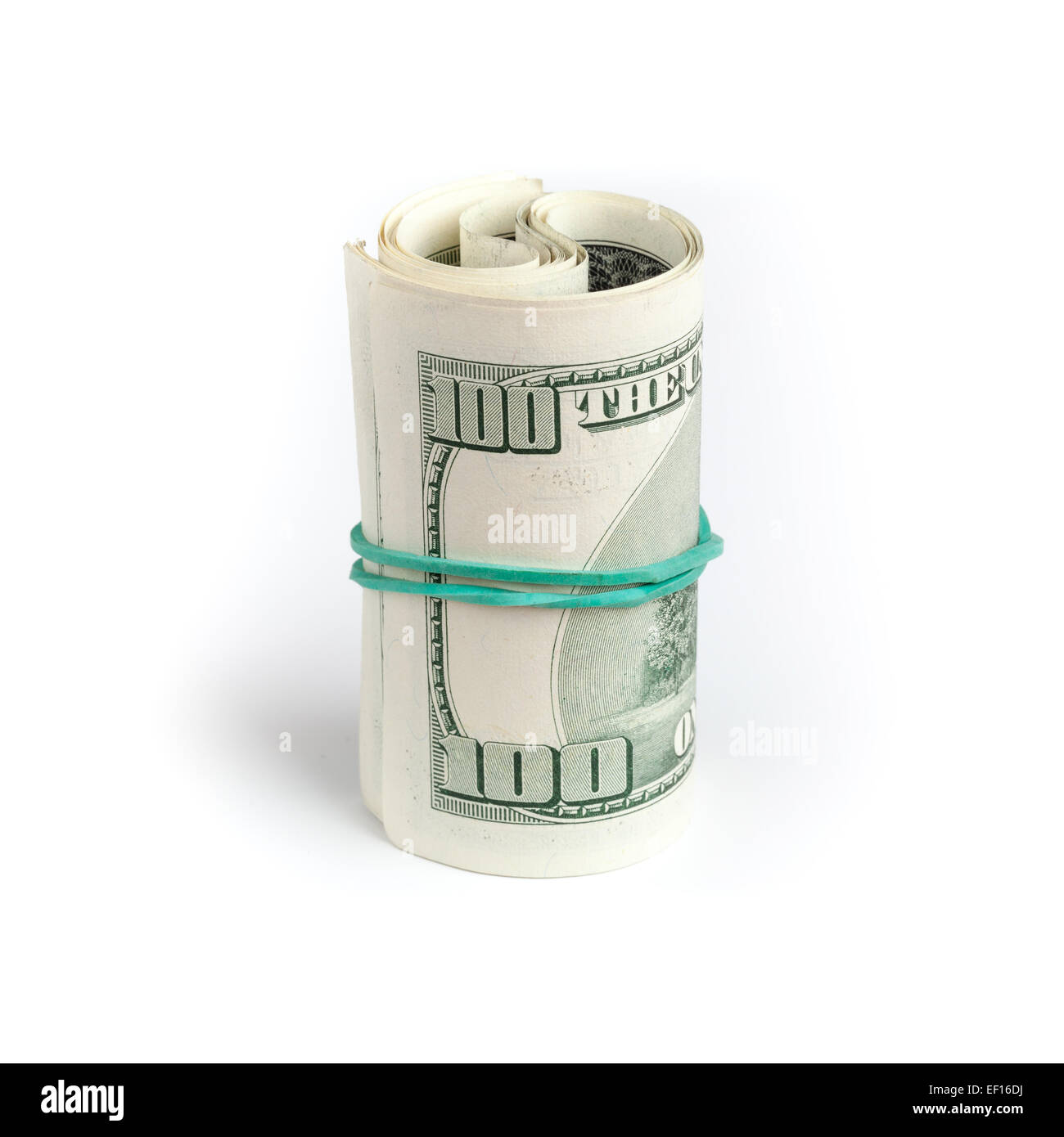 Dollars des Etats-Unis, rouleau de cent billets USD avec caoutchouc vert sur fond de table blanc. Selective focus Banque D'Images