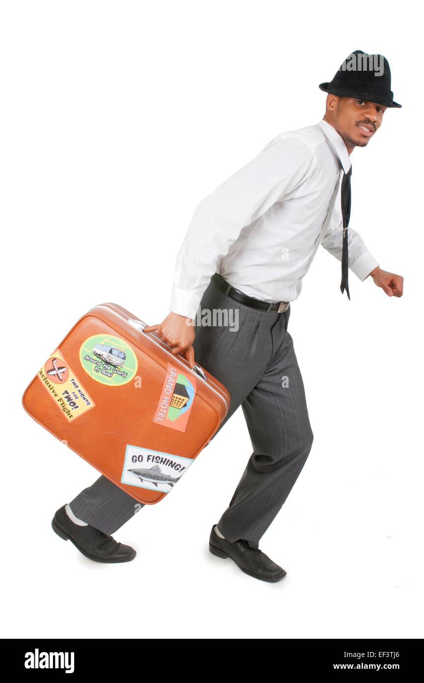 Homme qui court avec valise à la main Banque D'Images