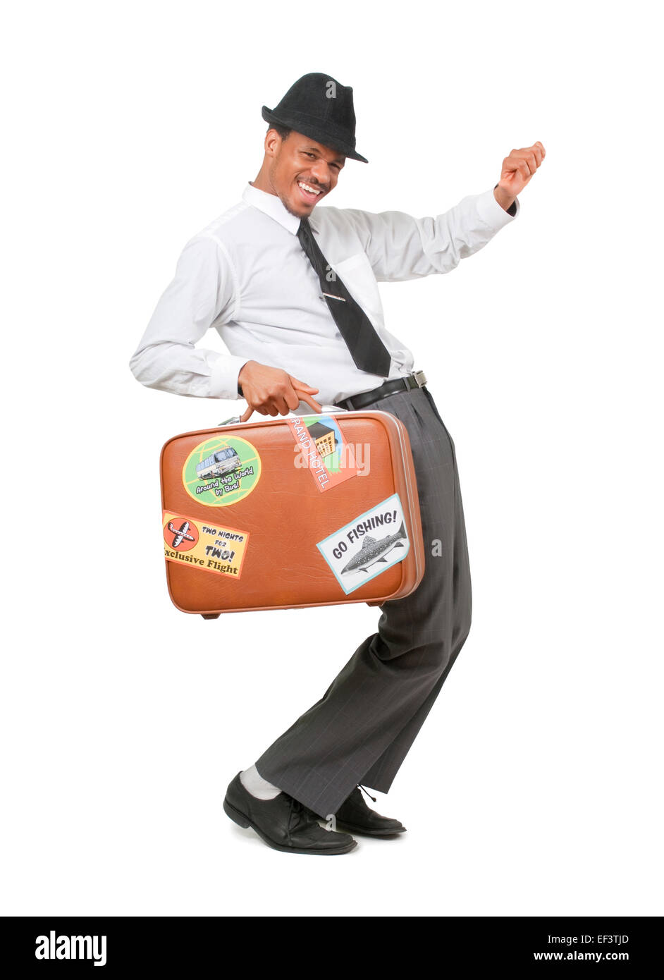 Happy man holding a suitcase Banque D'Images