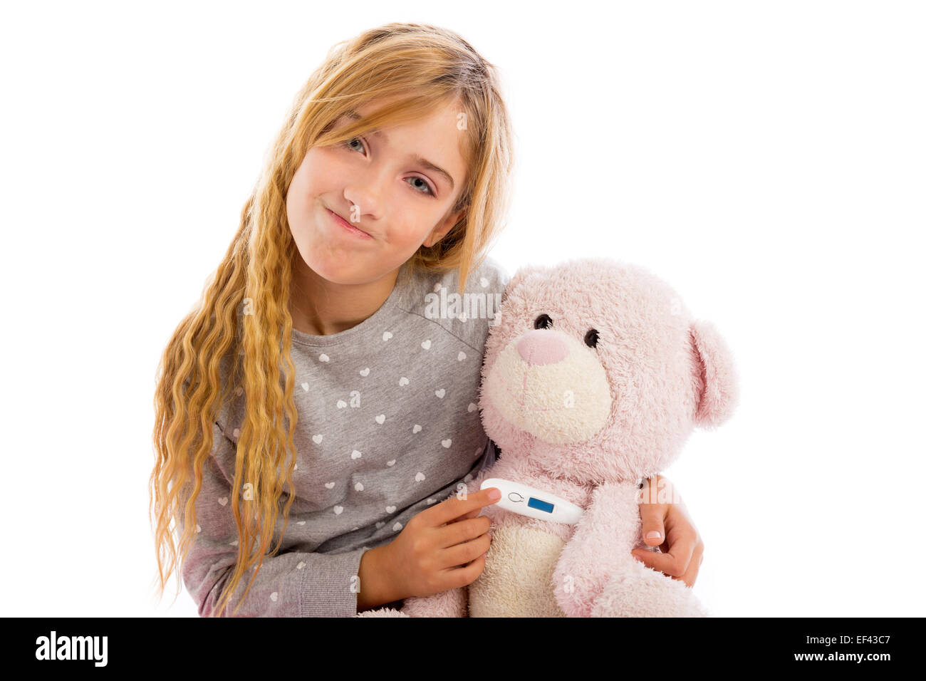 Fille blonde avec des ours et de la grippe en froid thermomètre pyjama Banque D'Images