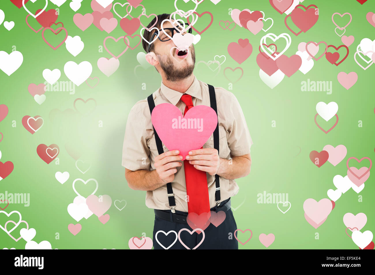 Image composite de hipster geek pleurer et carte holding heart Banque D'Images