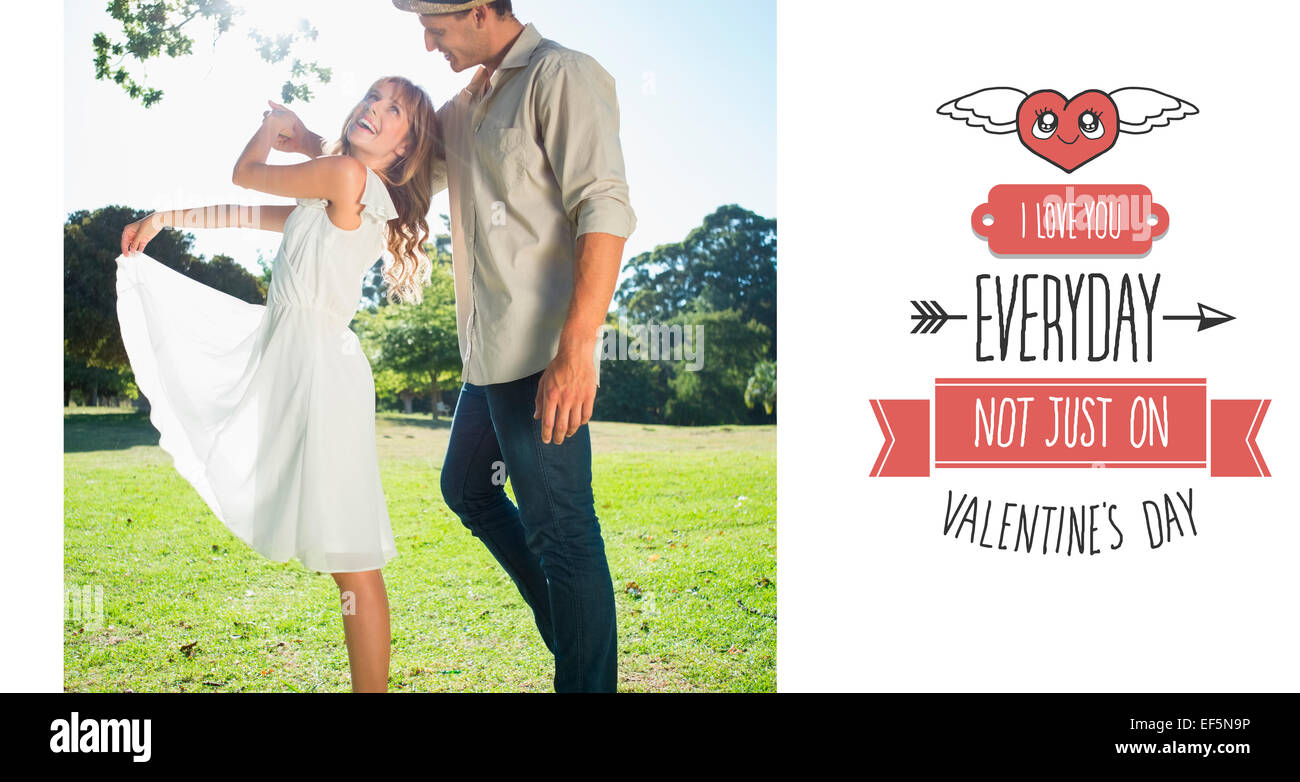 Image composite de cute couple dansant dans le parc et de rire Banque D'Images