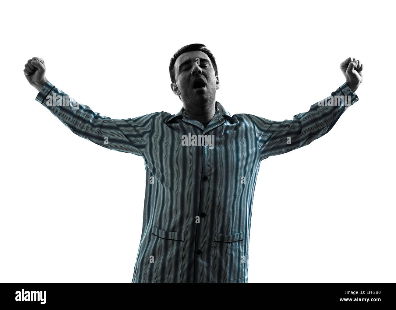 Un homme en pyjama se réveiller l'étirement silhouettes sur fond blanc Banque D'Images