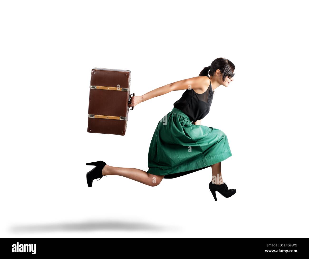 La femme s'exécute avec suitcase Banque D'Images