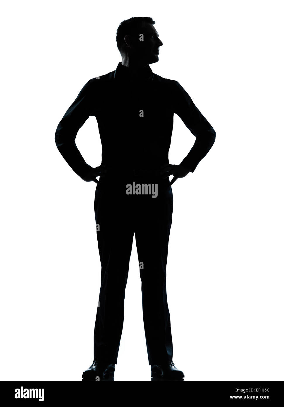 Un caucasian business man silhouette debout les mains sur les hanches en pleine longueur studio isolé sur fond blanc Banque D'Images