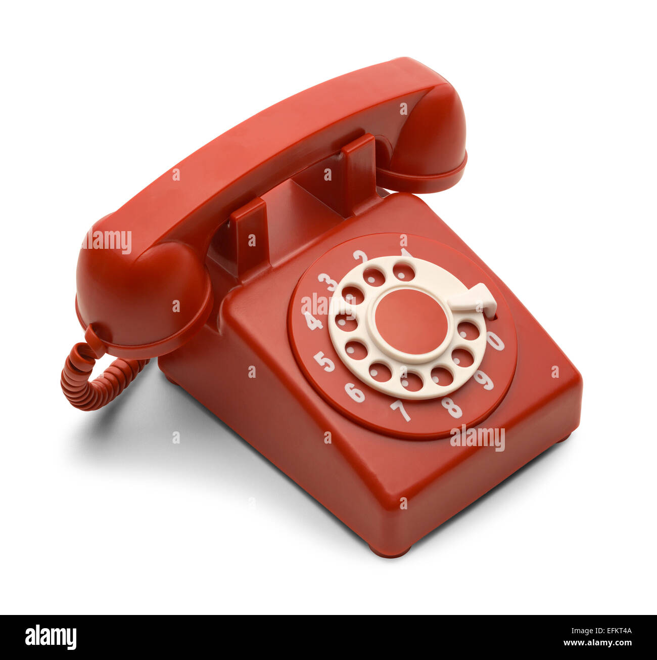 Téléphone à cadran rouge et blanc isolé sur fond blanc. Banque D'Images