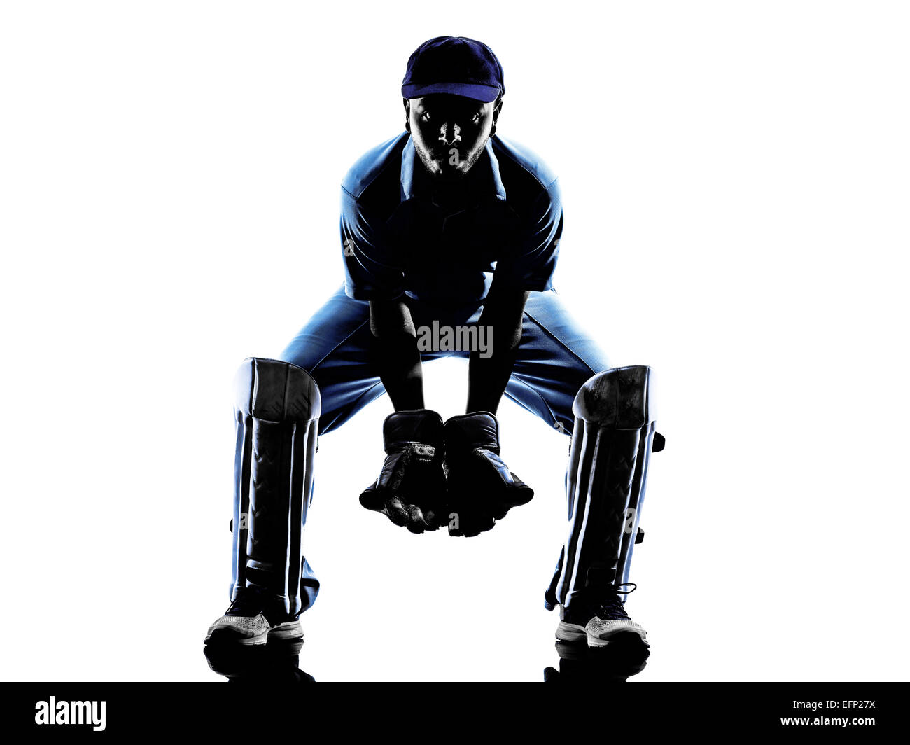 Joueur de Cricket destinataire en silhouette ombre sur fond blanc Banque D'Images