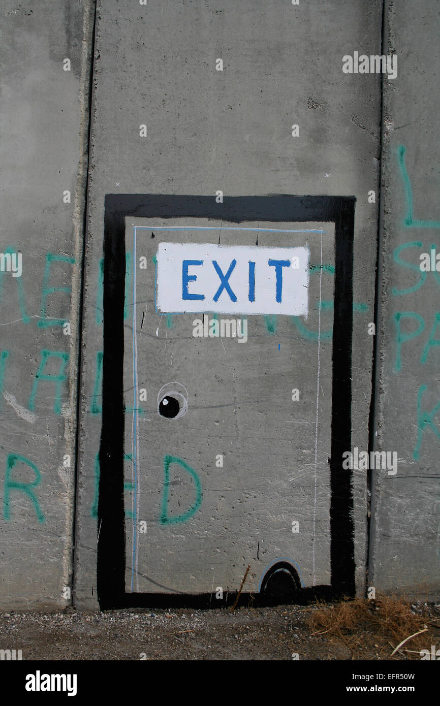 Exit sign painted ironique sur la barrière de séparation, Bethléem Banque D'Images