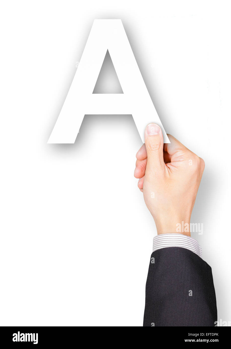 Part of businessman holding paper alphabet A Banque D'Images