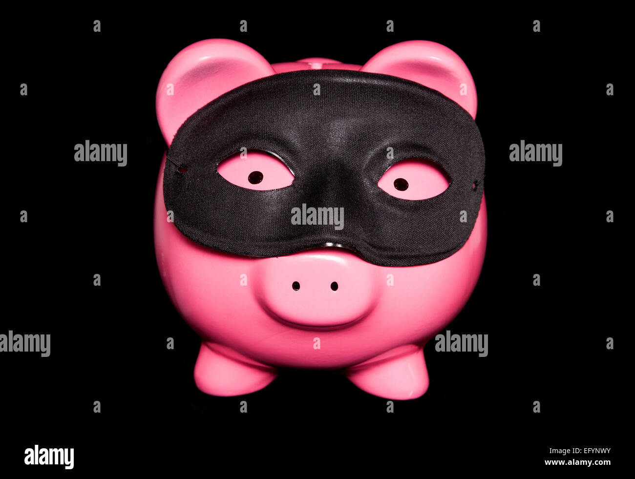 Piggy Bank wearing black masquerade mask décoration Banque D'Images