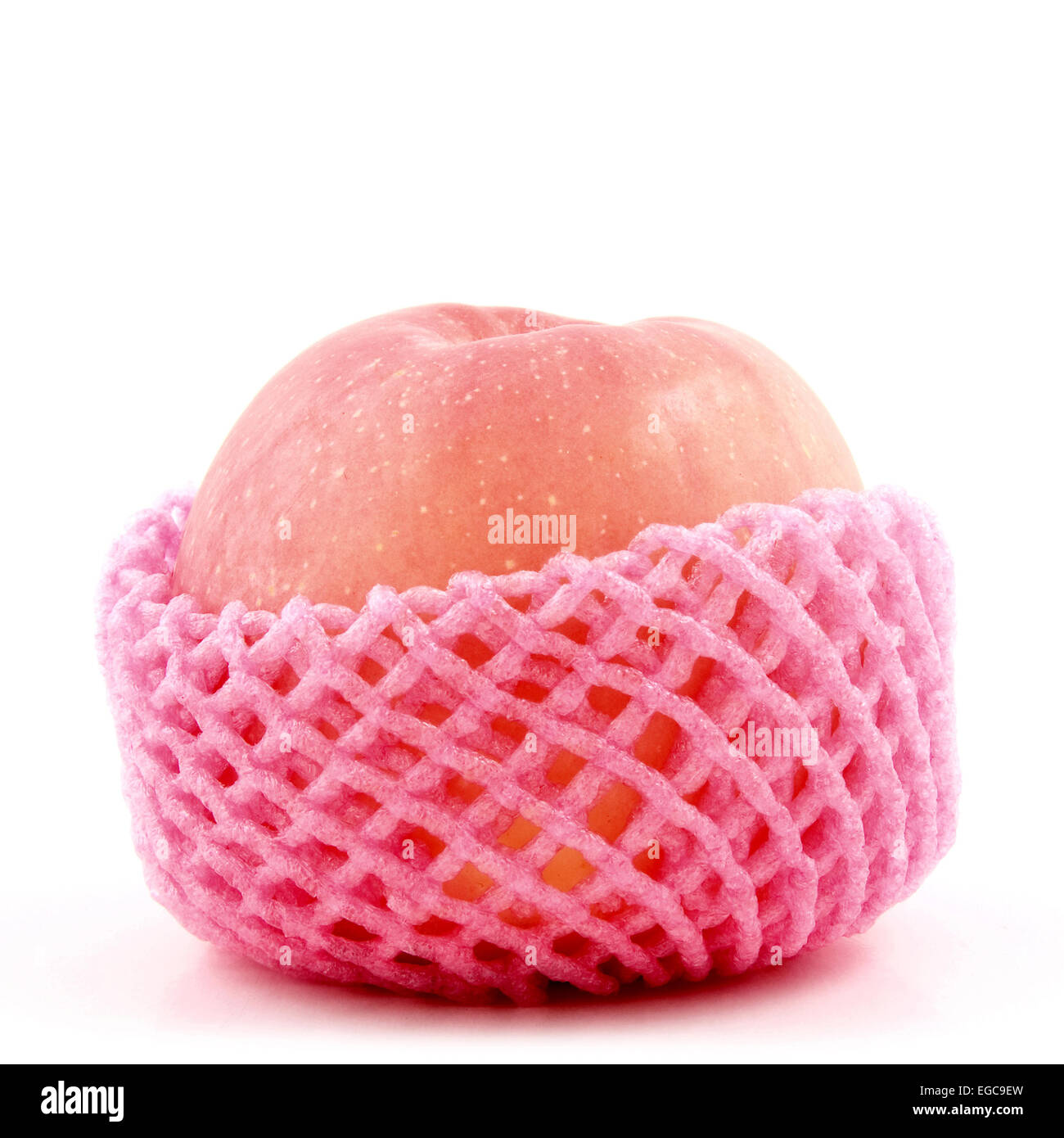 L'un des apple en string sac sur fond blanc Banque D'Images