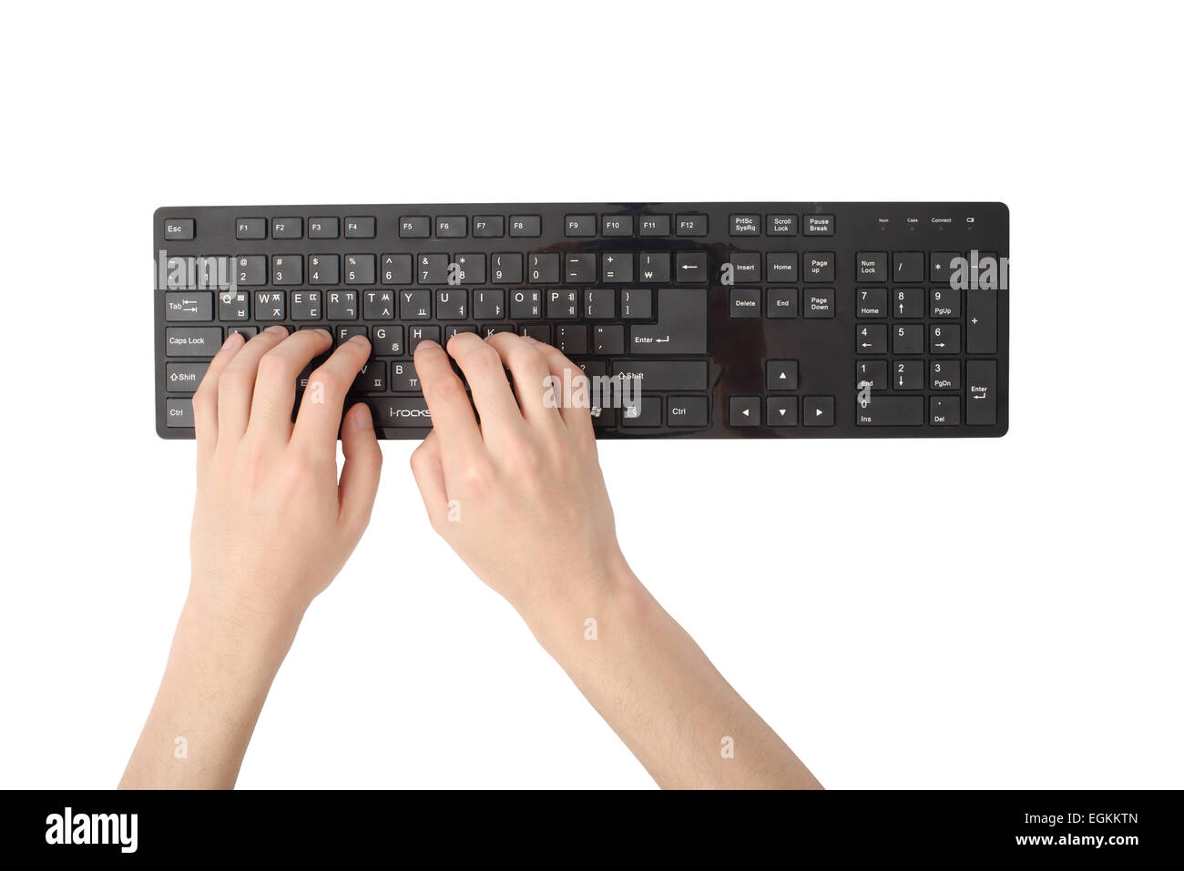 Les mains sur un clavier noir, isolé sur blanc Banque D'Images
