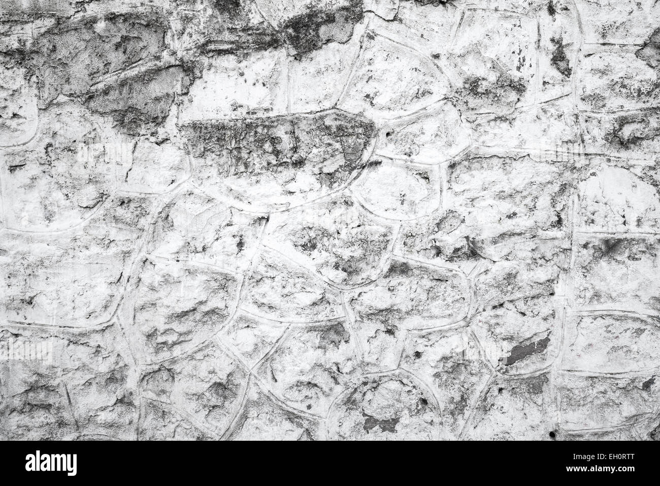 Vieux mur de pierres peintes en blanc, la texture de fond photo Banque D'Images