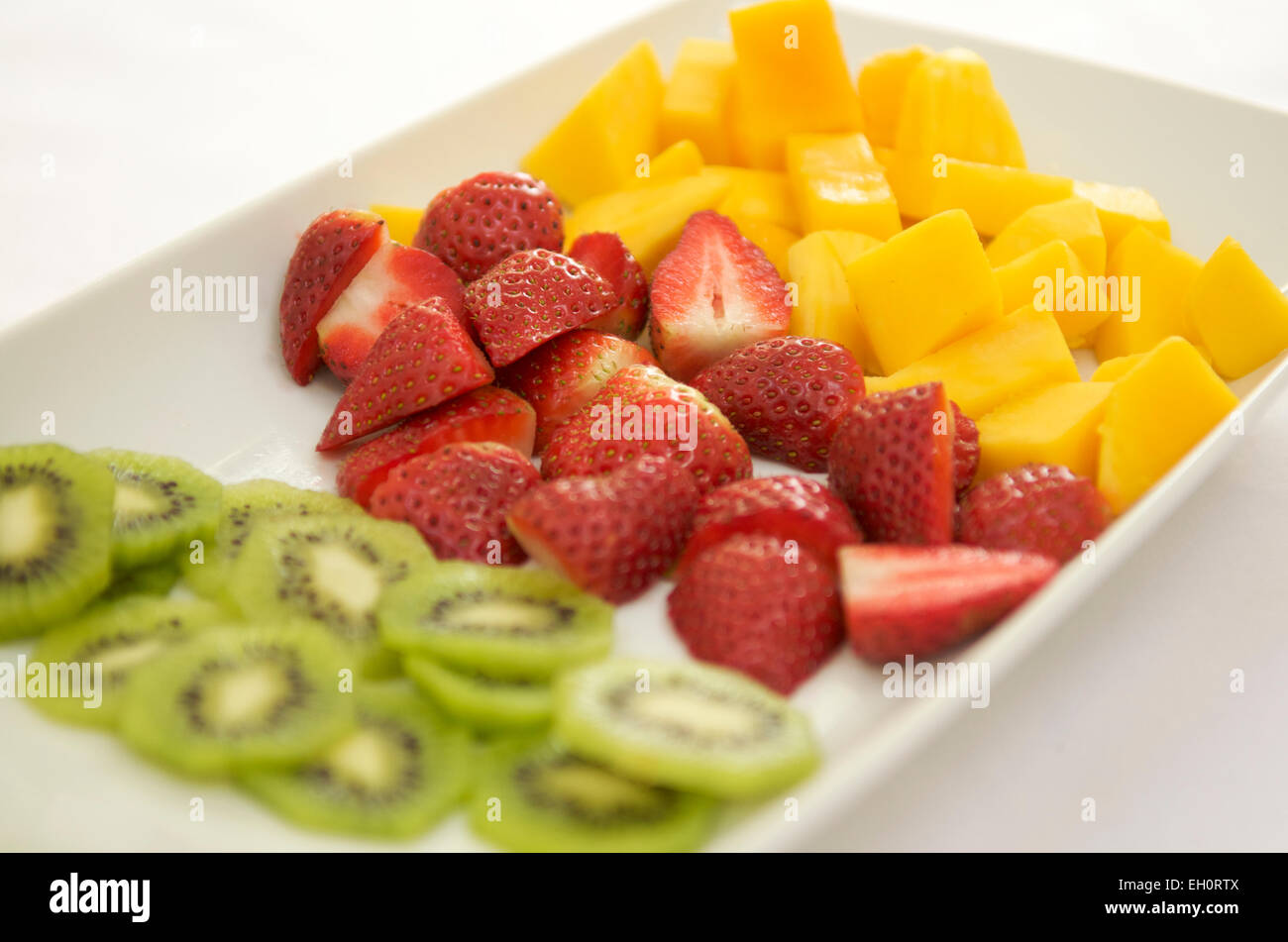 Sélection de fruits frais au petit déjeuner Banque D'Images