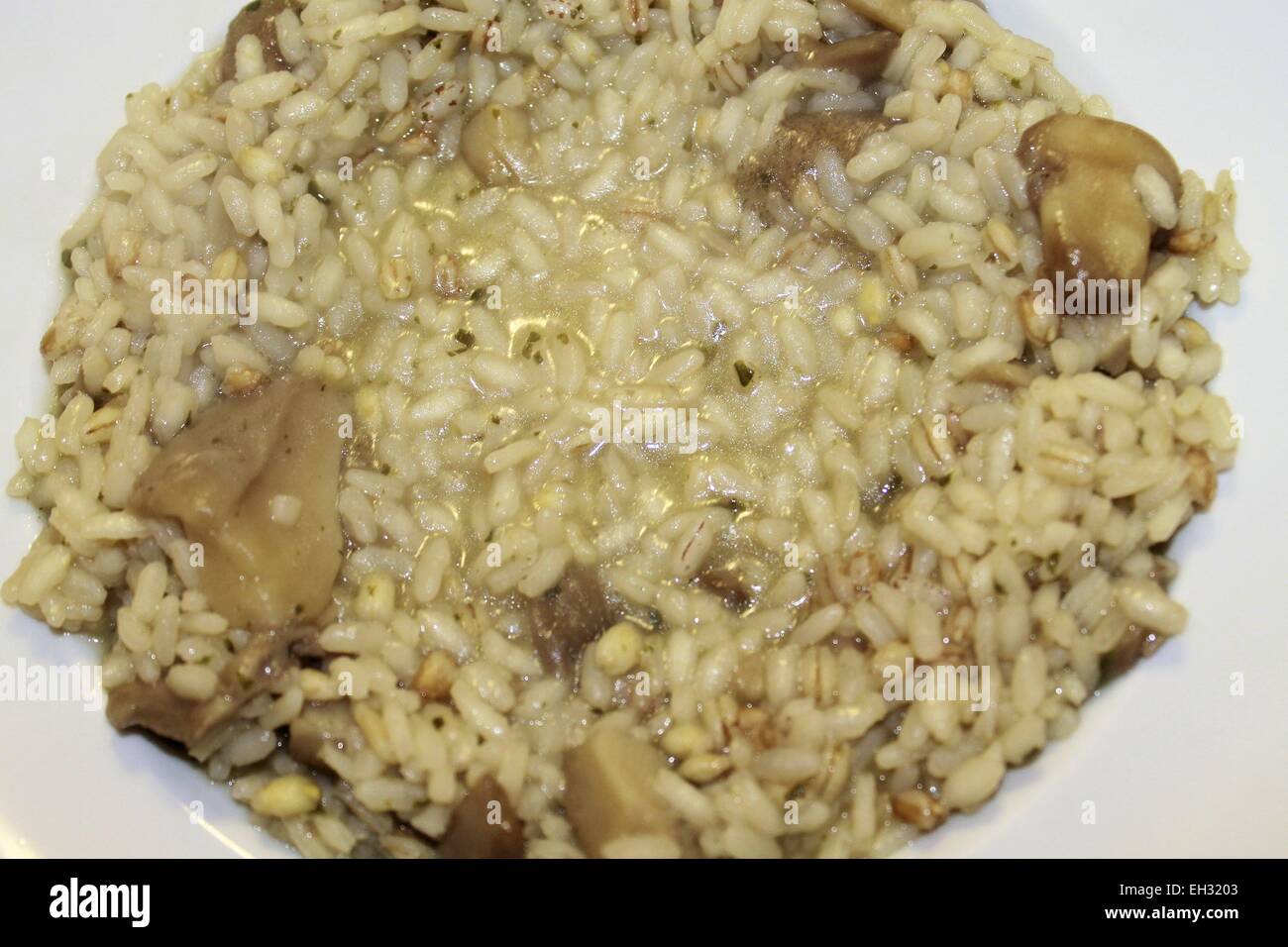 Le riz fait maison aux champignons et fromage parmesan râpé Photo Stock Alamy