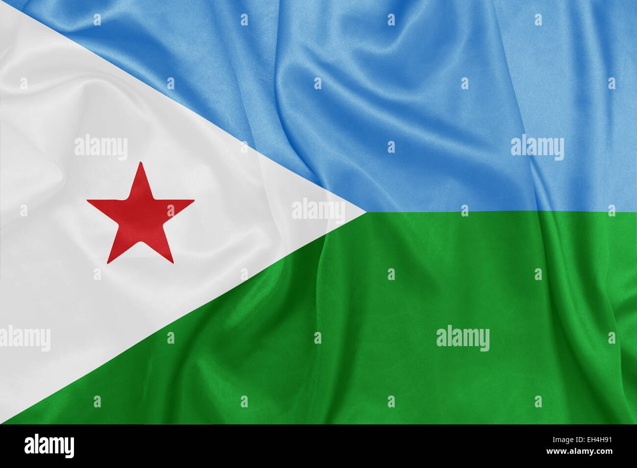Djibouti - brandissant un drapeau national sur la texture de la soie Banque D'Images