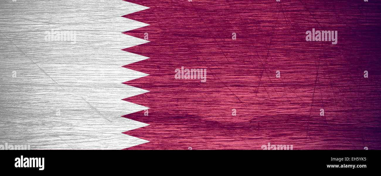 Le Qatar d'un drapeau ou une bannière sur la texture en bois Banque D'Images