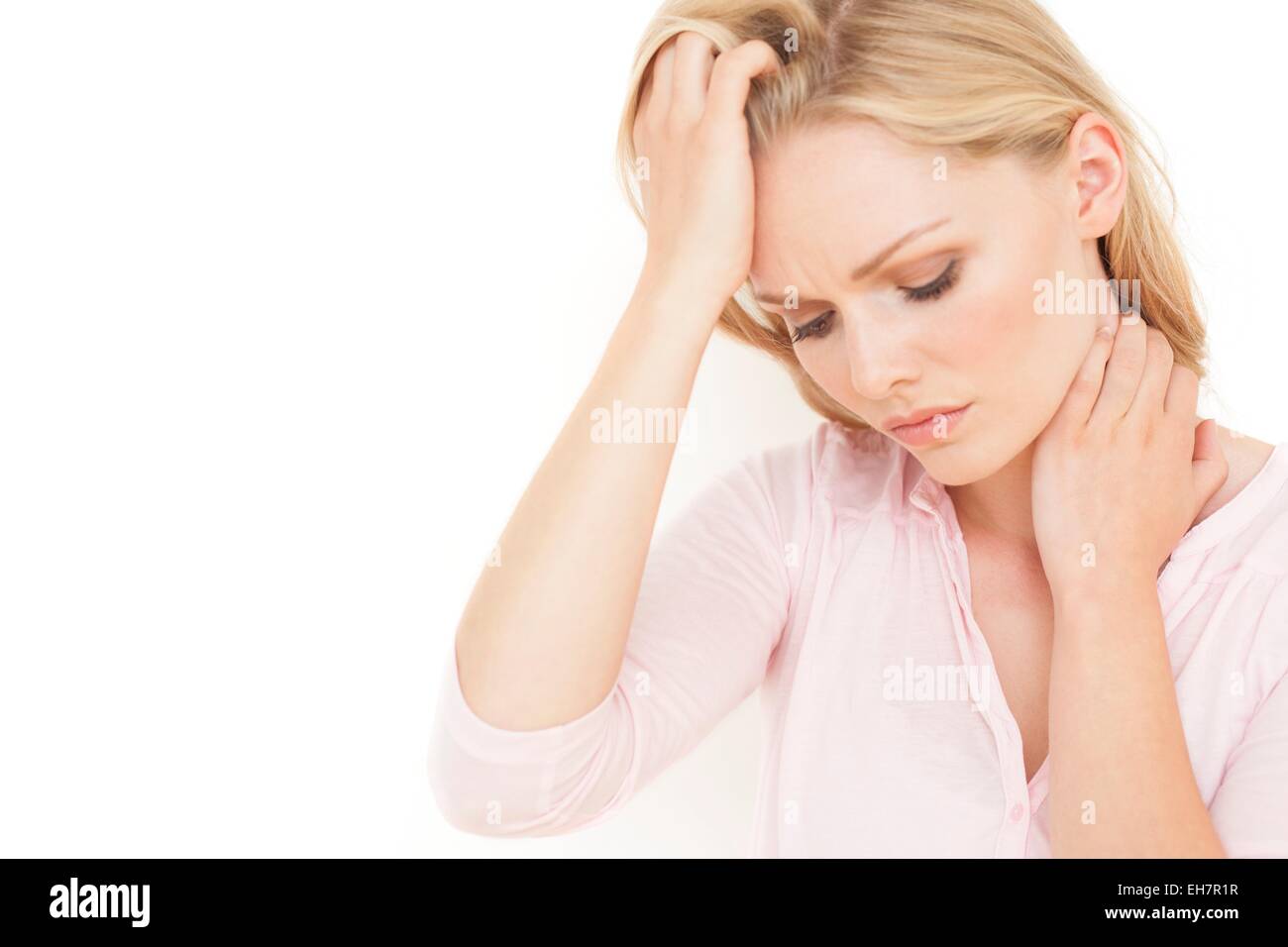 Woman with hand on head Banque D'Images