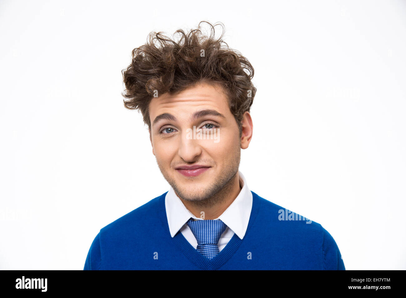 Smiling man with curly hair over white background Banque D'Images