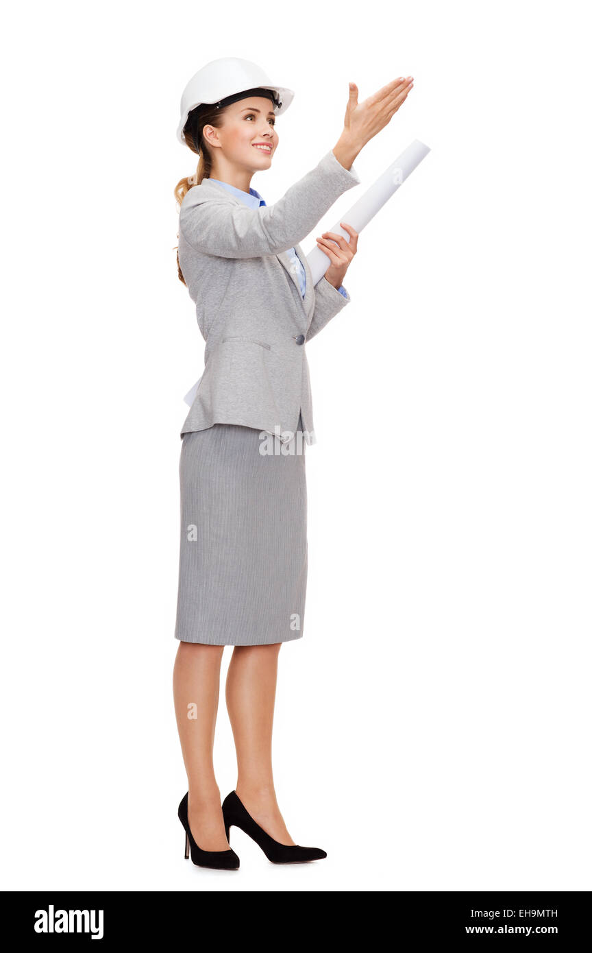 Smiling architect blueprint helmet dans Banque D'Images